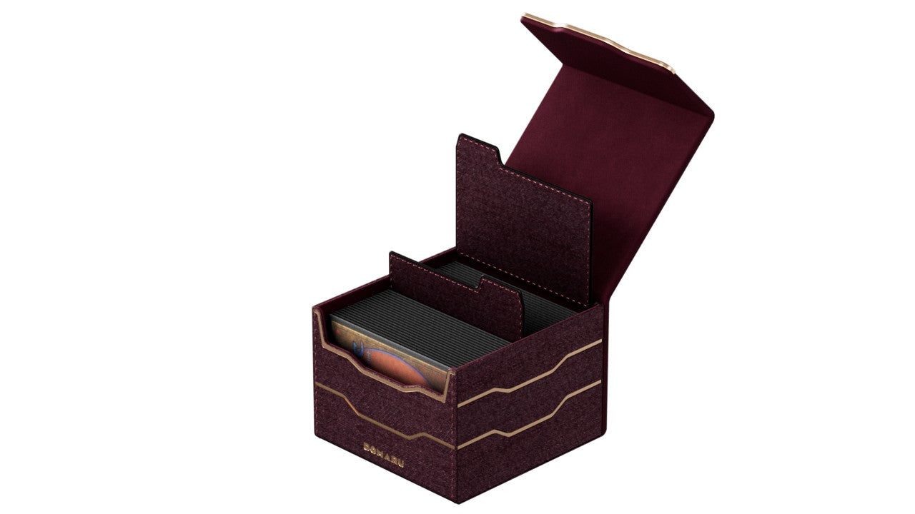 Gatherers' Tavern: Domaru Armory Collection Horizon 133+ Deck Box - Carnelian (PREORDER) - Dark red rectangular deck box with maroon interior, gold wave accents, and a magnetic flip lid open showing compartment.
