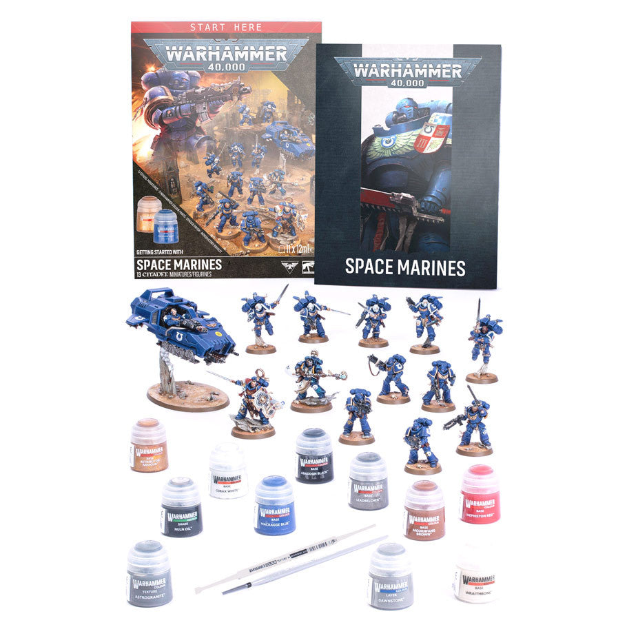 Warhammer 40,000 - Getting Started with Space Marines - Warhammer 40,000 Space Marines starter kit with painted blue miniatures, two books, paint pots, and brushes on white.