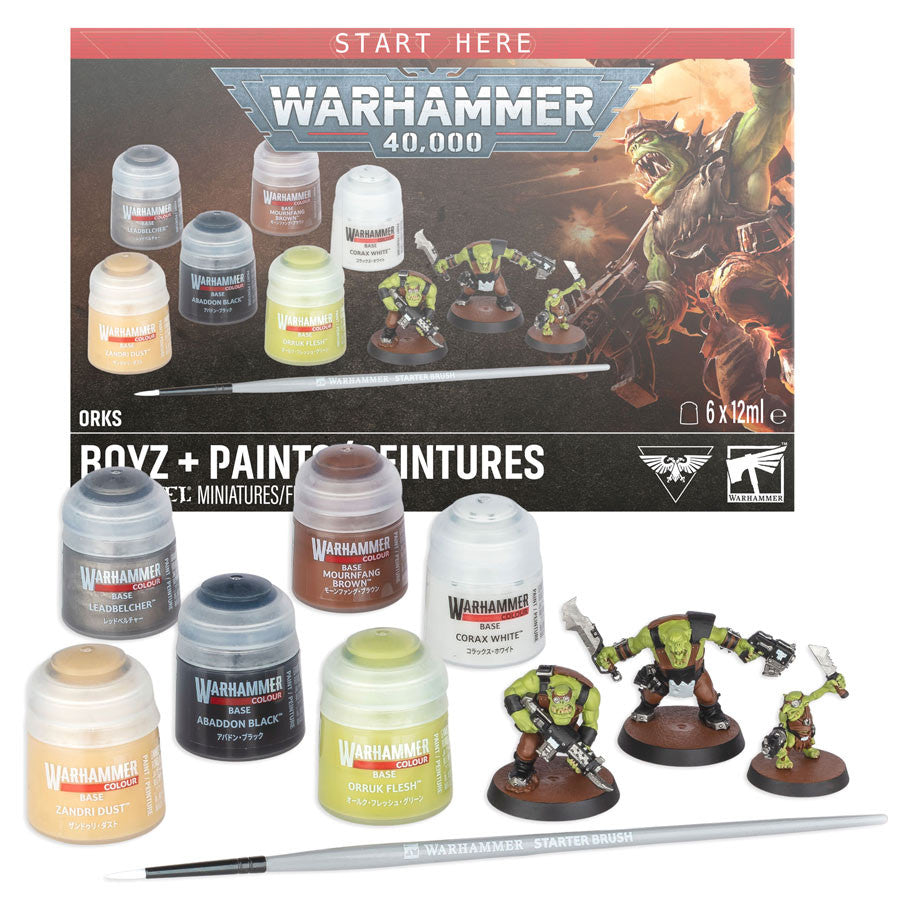 Warhammer 40,000: Boyz + Paints Set - Warhammer 40,000 Boyz + Paints Set with six paint pots, three painted Ork miniatures, and a paintbrush on black surface.