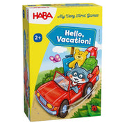 My Very First Games: Hello Vacation - Colorful children’s game box with a red car carrying a raccoon, backpack, and teddy bear on a sandy path with blue sky.