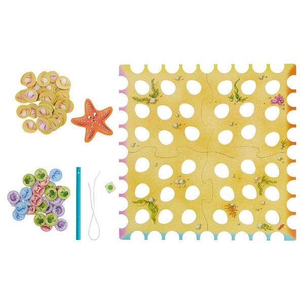 Sebastian Seastar - Colorful foam sea creature-themed game mat with circular holes, starfish, and shell tokens for kids.