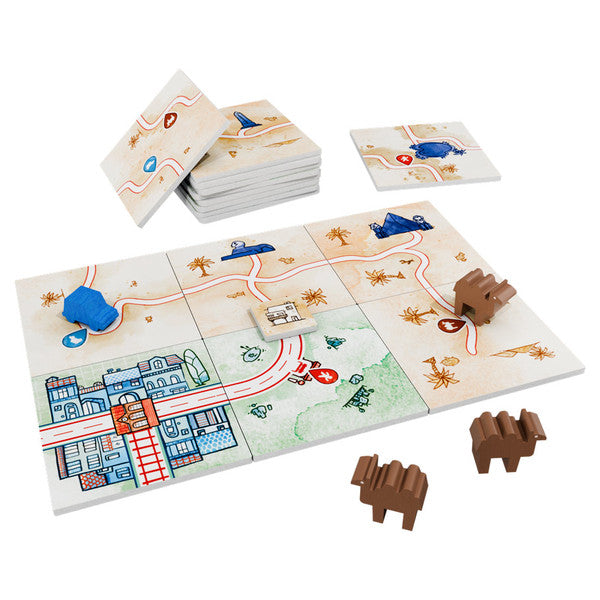 Railroad Tiles: Desert Expansion - Stack of square game tiles featuring desert terrain with cacti and railroad tracks, wooden camel and train pieces in blue.