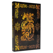 D&D 5E: The Field Guide to Floral Dragons Deluxe Edition - Black hardcover book with intricate gold floral dragon artwork and decorative borders on front and spine.