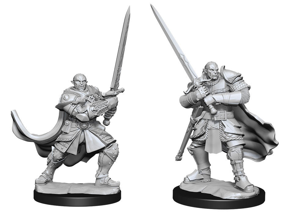 D&D Nolzur's Marvelous Miniatures: Half-Orc Paladin Male - Gray plastic miniature of a half-orc paladin wielding a large sword, clad in detailed armor with a flowing cape.