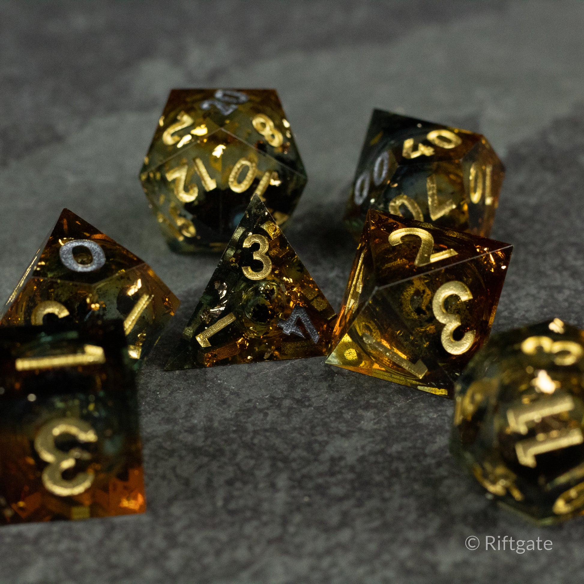 Ambershadow Dice Set - Translucent amber polyhedral dice set with gold numbers, featuring a liquid core design.