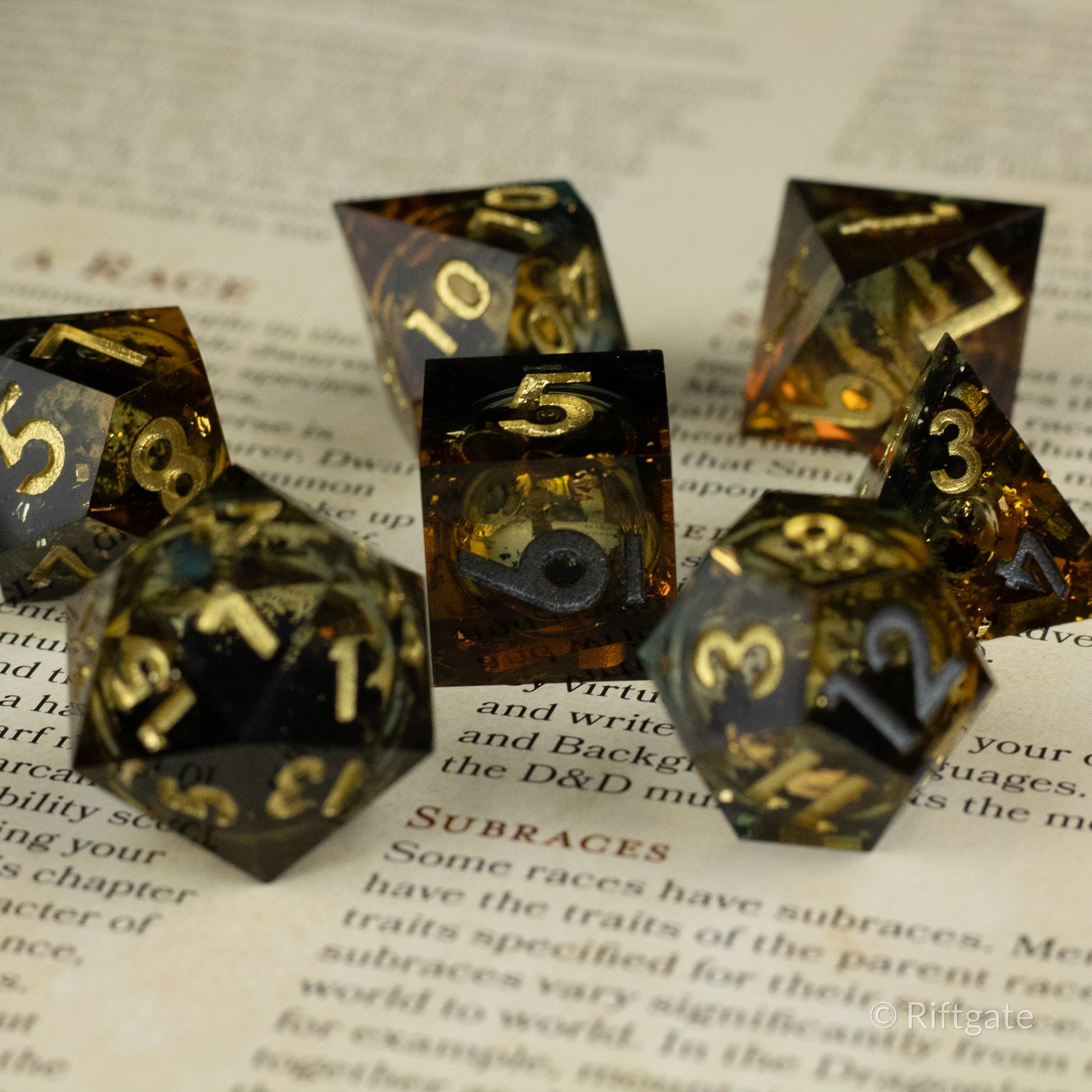 Ambershadow Dice Set - Amber-hued translucent polyhedral dice set with gold numbering and smoky inclusions.