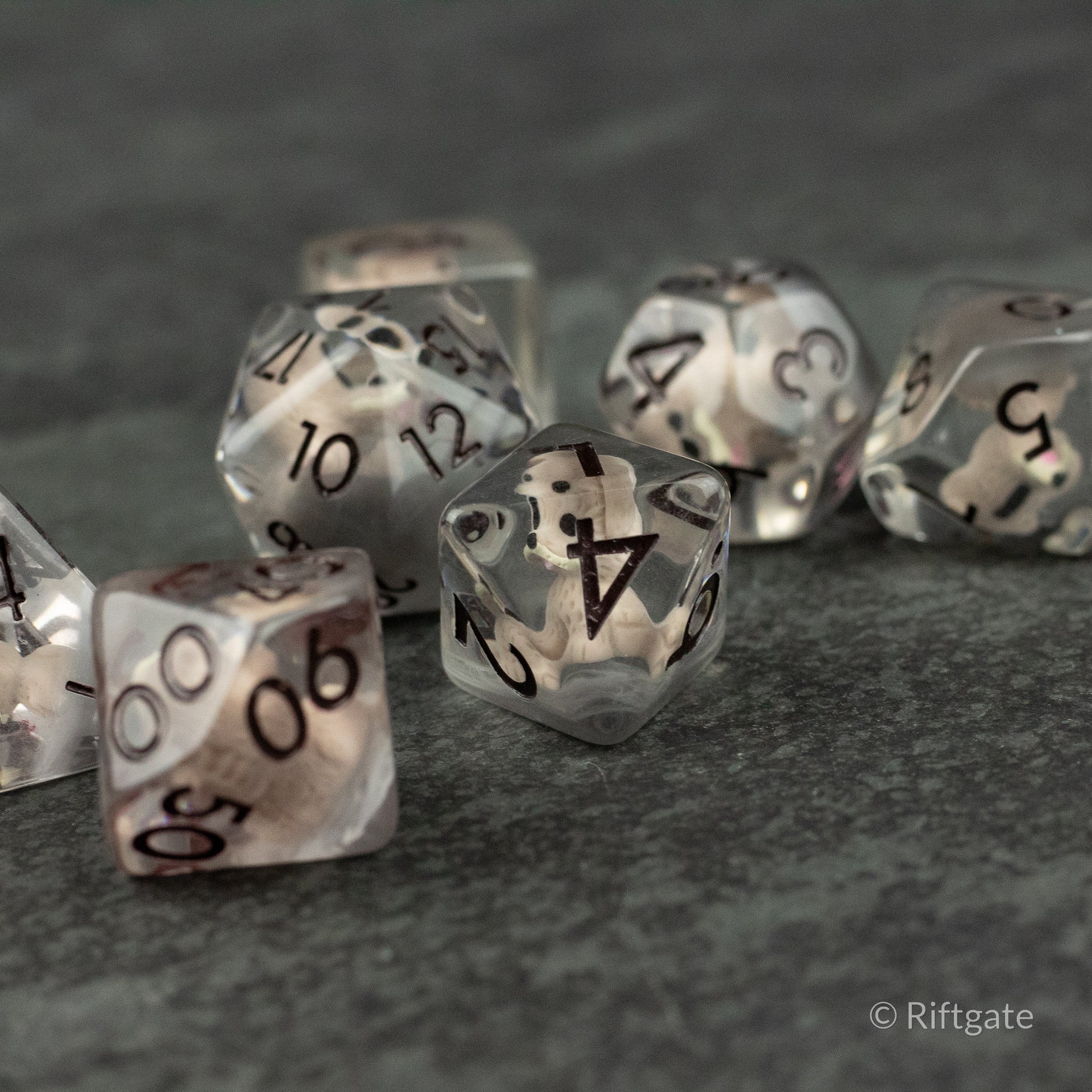 Scruffy Dog Dice - Translucent gray polyhedral dice set with black numbers, featuring a smoky, cloudy appearance.