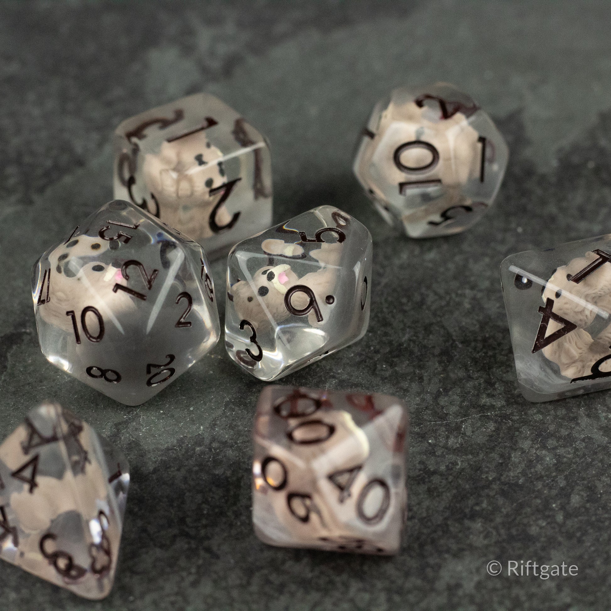 Scruffy Dog Dice - Translucent gray polyhedral dice set with black numbers, including d4, d6, d8, d10, d12, and d20 faces.