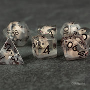 Scruffy Dog Dice - Set of six transparent polyhedral dice with black numbers and embedded brown and white dog fur-like flakes.
