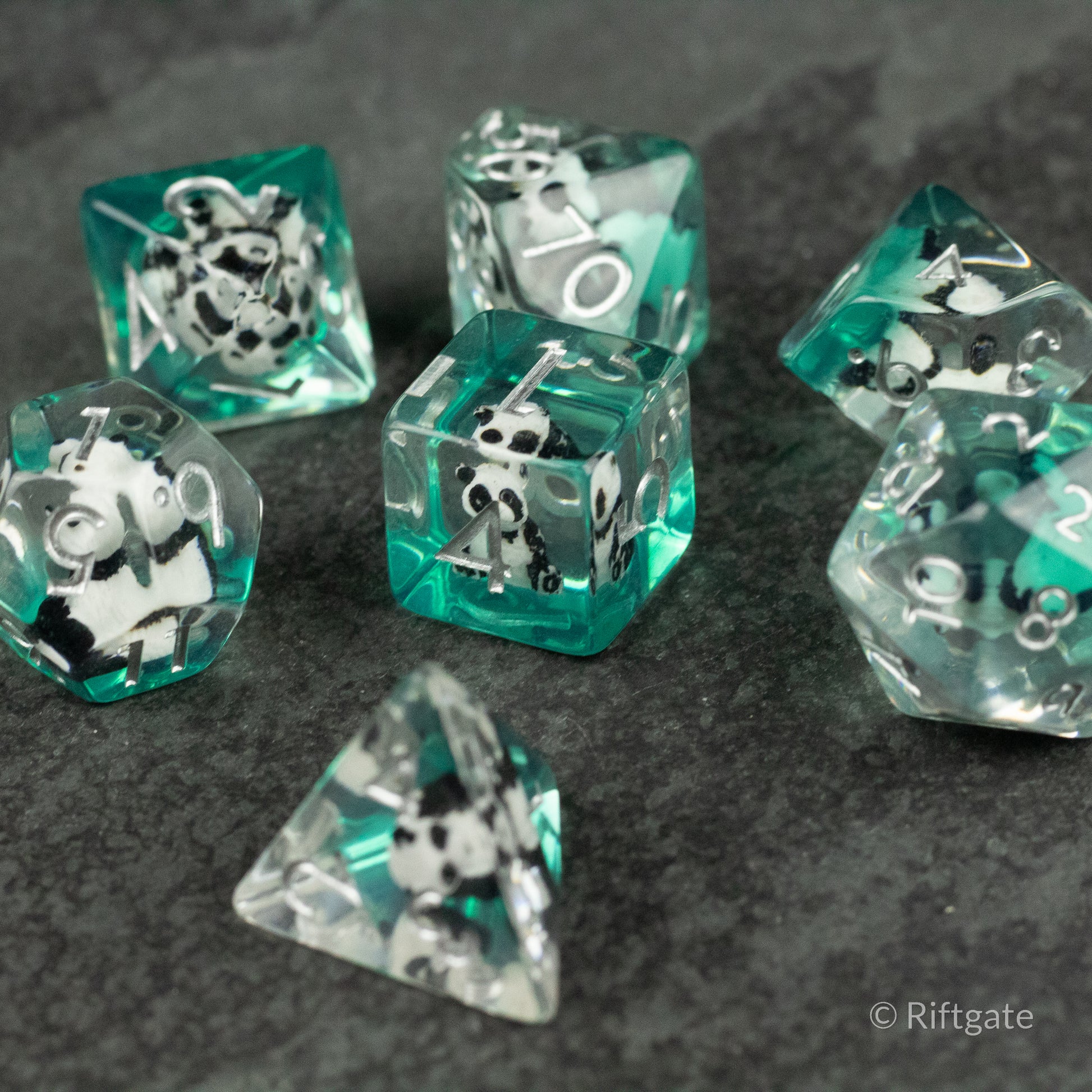 Panda Dice Set - Transparent teal polyhedral dice set with black and white panda illustrations inside each die.