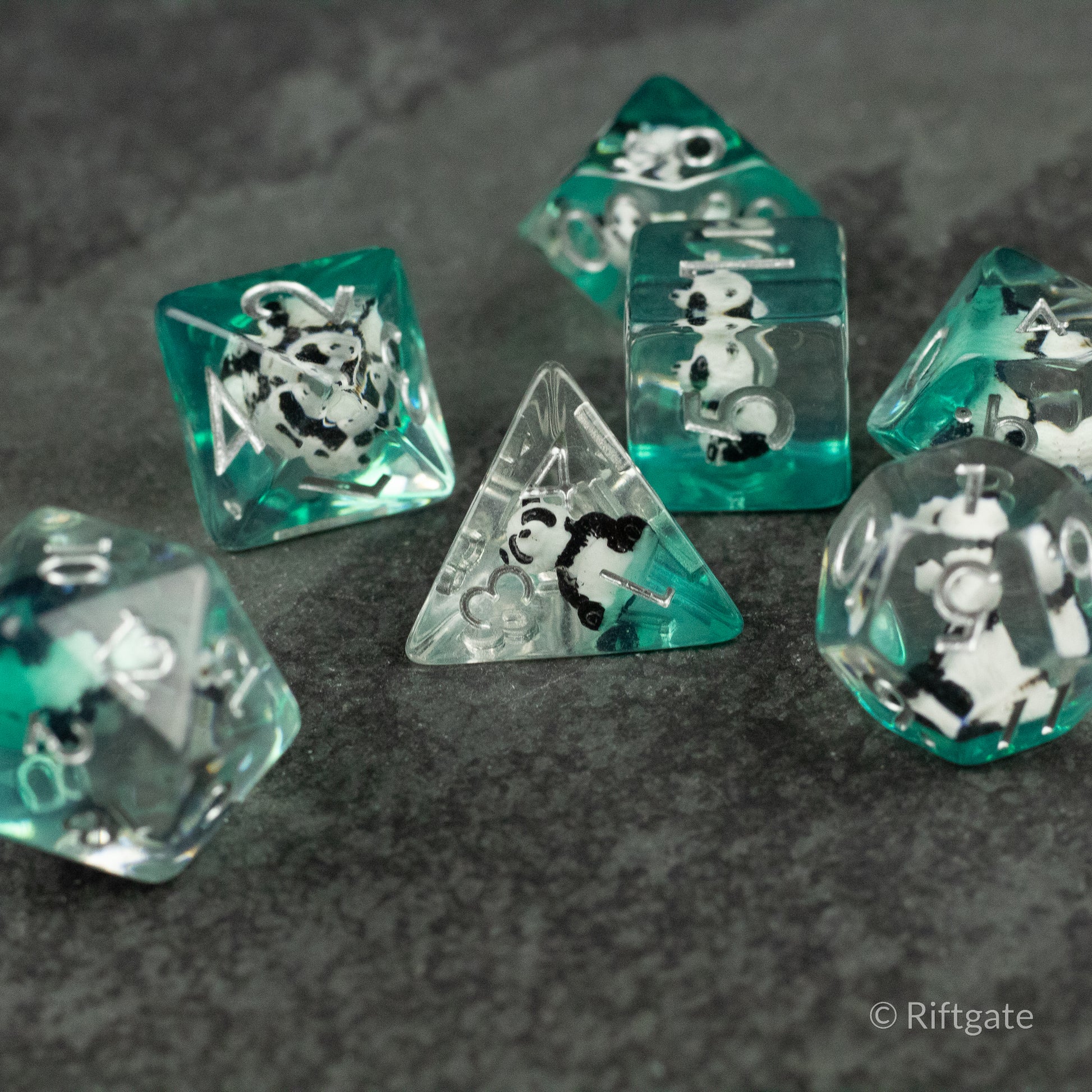 Panda Dice Set - Translucent green and clear polyhedral dice set with black and white panda illustrations inside each die.