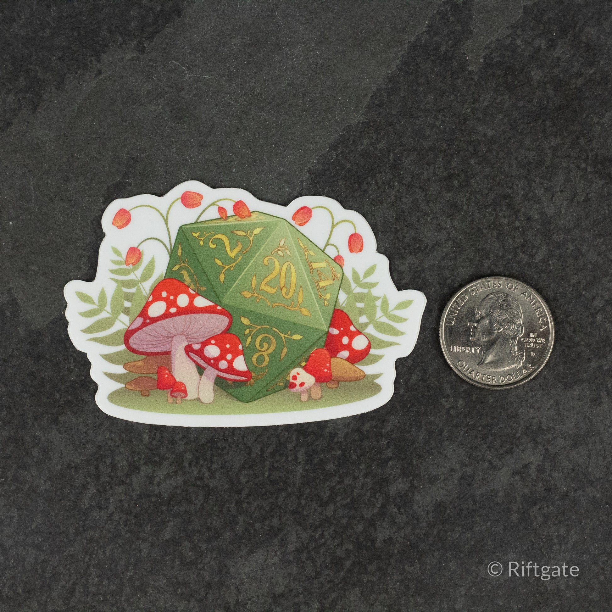 Mushrooms D20 DnD Sticker - Green 20-sided die decorated with mushroom designs surrounded by red and white mushrooms sticker next to a quarter for size.