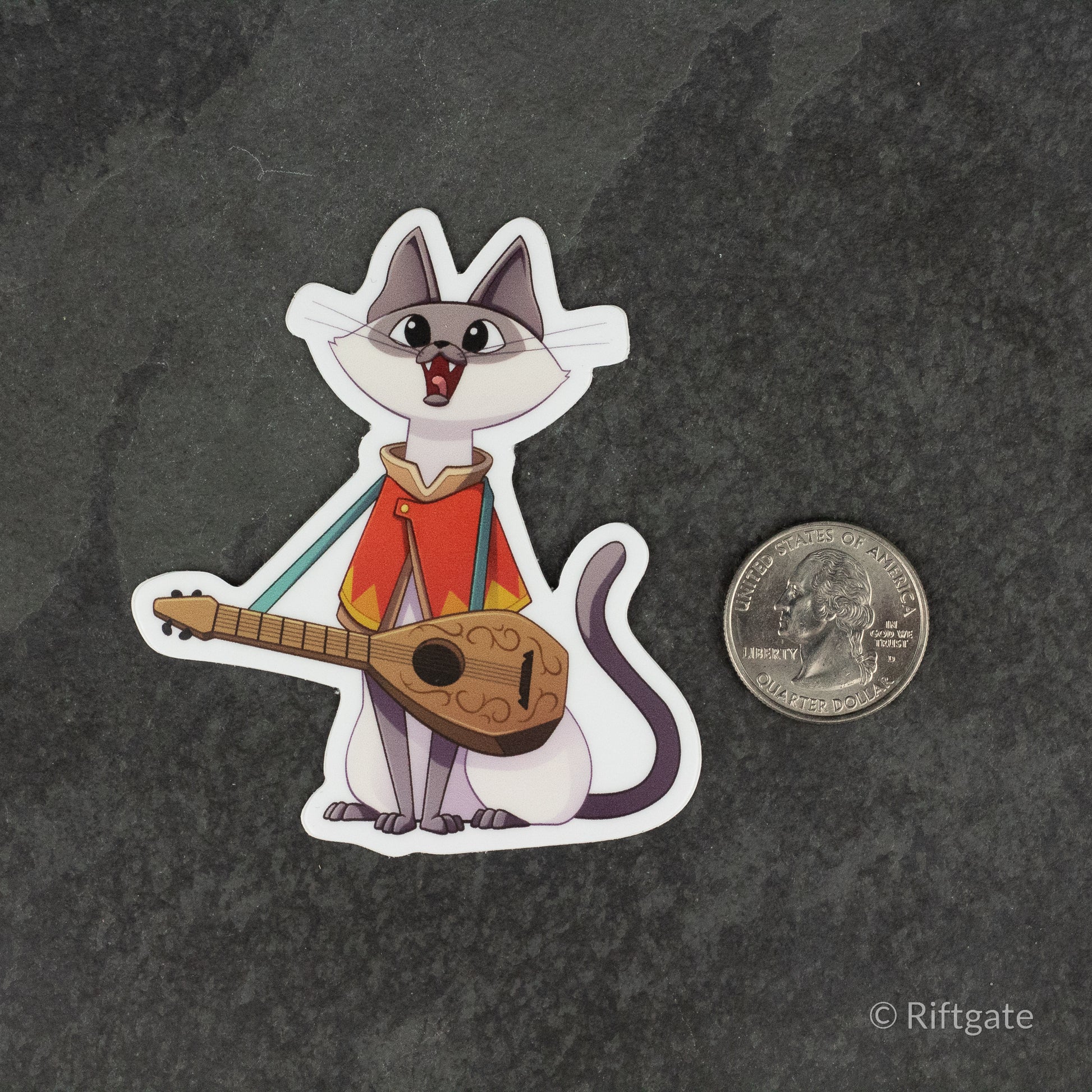 Bard Class D&D Cat Sticker - Cartoon cat dressed as a bard with a lute, colorful cloak, white outline sticker next to a quarter for size.