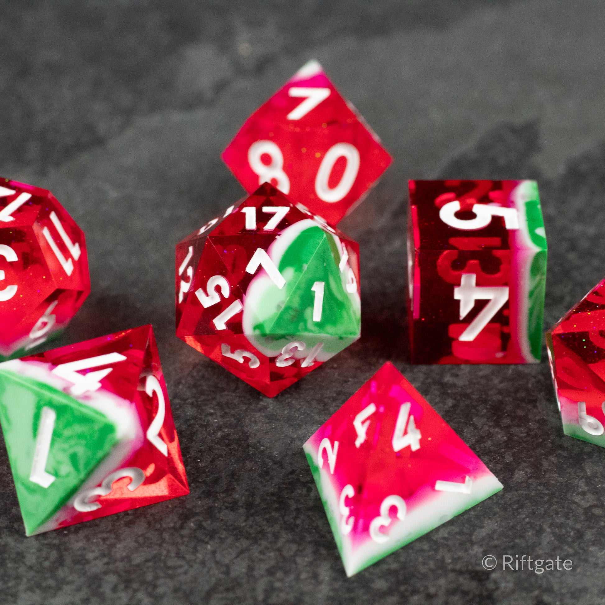 Watermelon Sharp Edge Dice - Set of translucent red and green sharp-edged dice with white numbers, watermelon-inspired design.