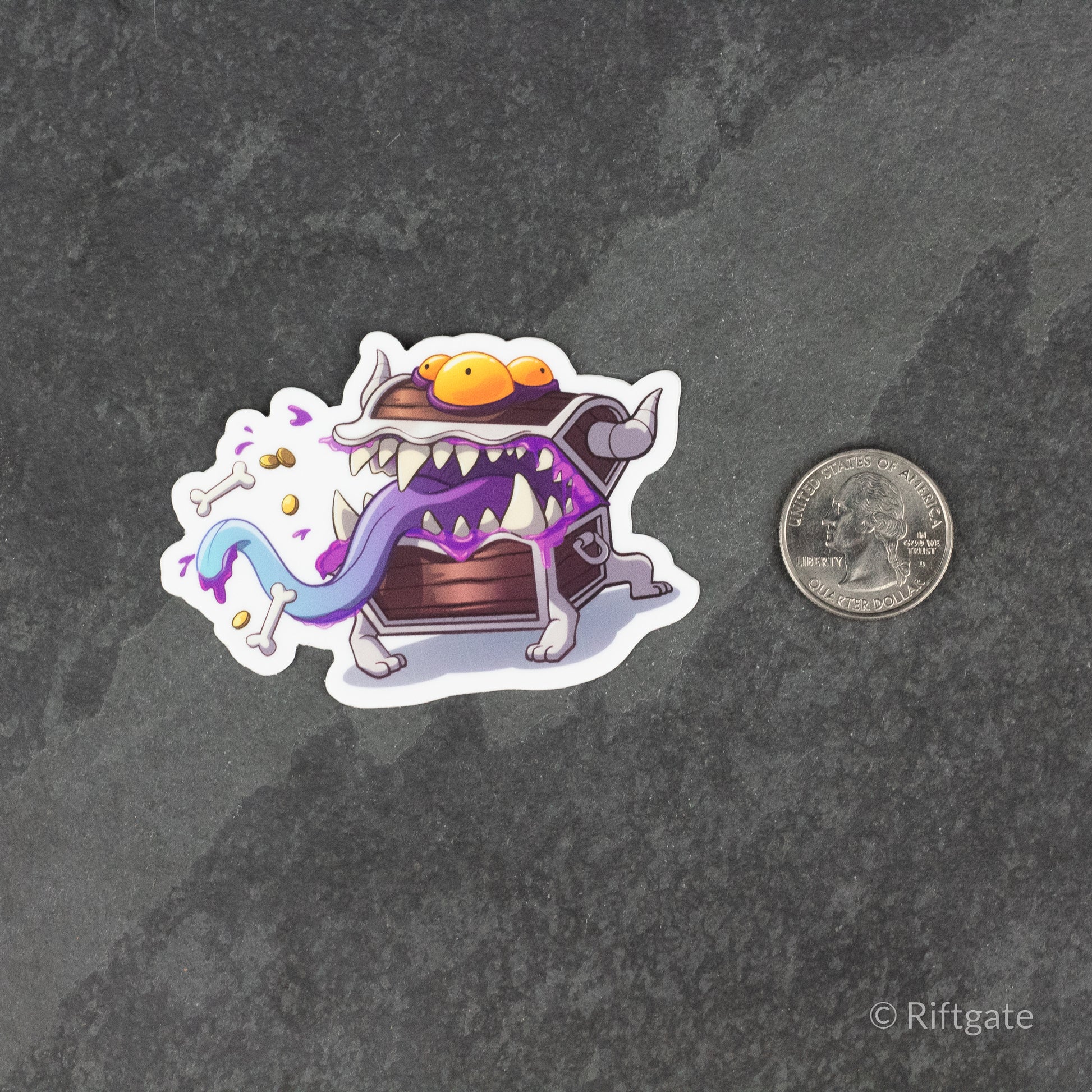 Mimic DnD Sticker - Colorful fantasy-style sticker of a purple mimic treasure chest with a long blue tongue and sharp teeth next to a quarter.