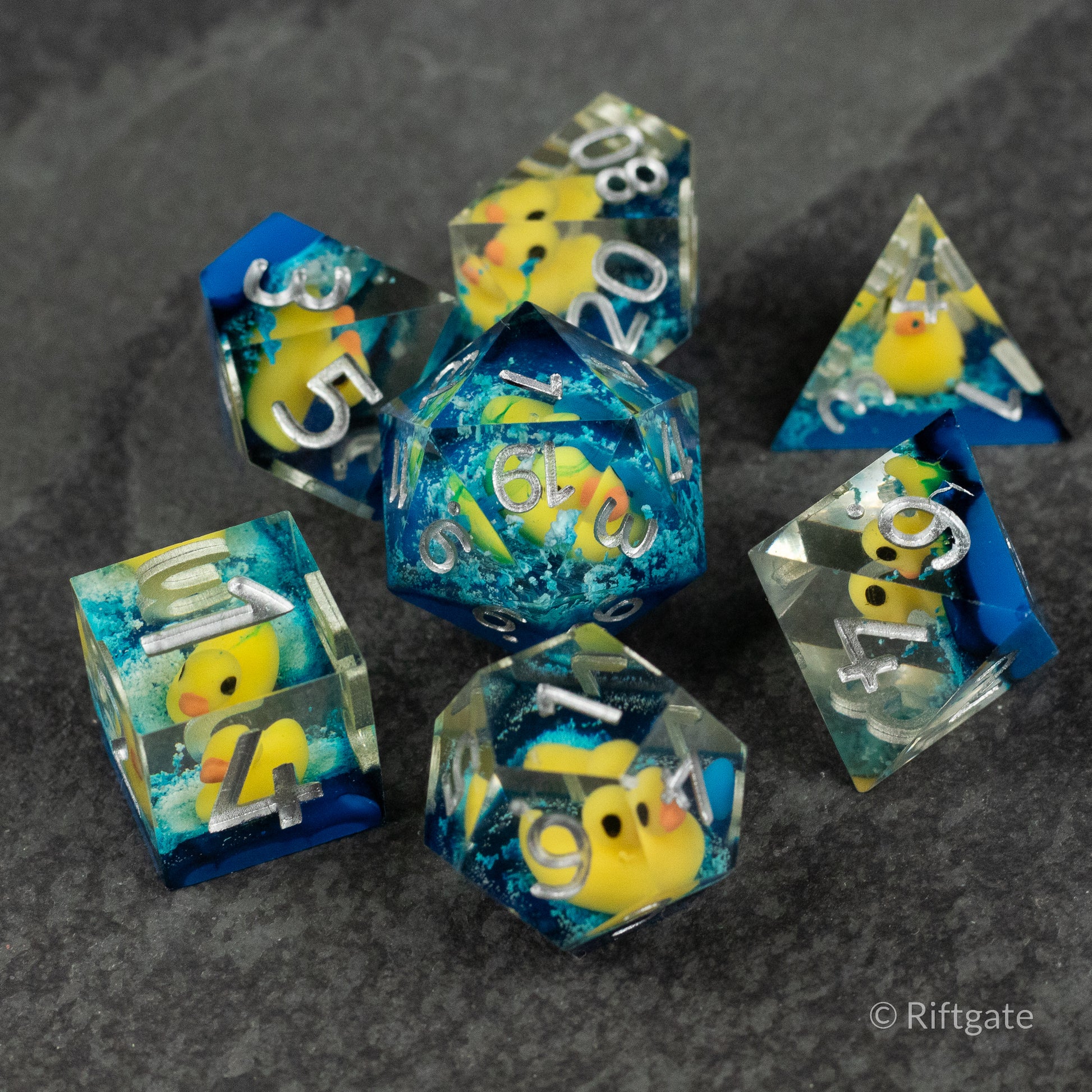 Rubber Duck Sharp Edge Dice - Set of transparent sharp-edged dice with floating yellow rubber ducks inside and white numbering.