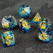 Rubber Duck Sharp Edge Dice - Set of clear blue sharp-edged polyhedral dice with embedded yellow rubber ducks and white numbering.