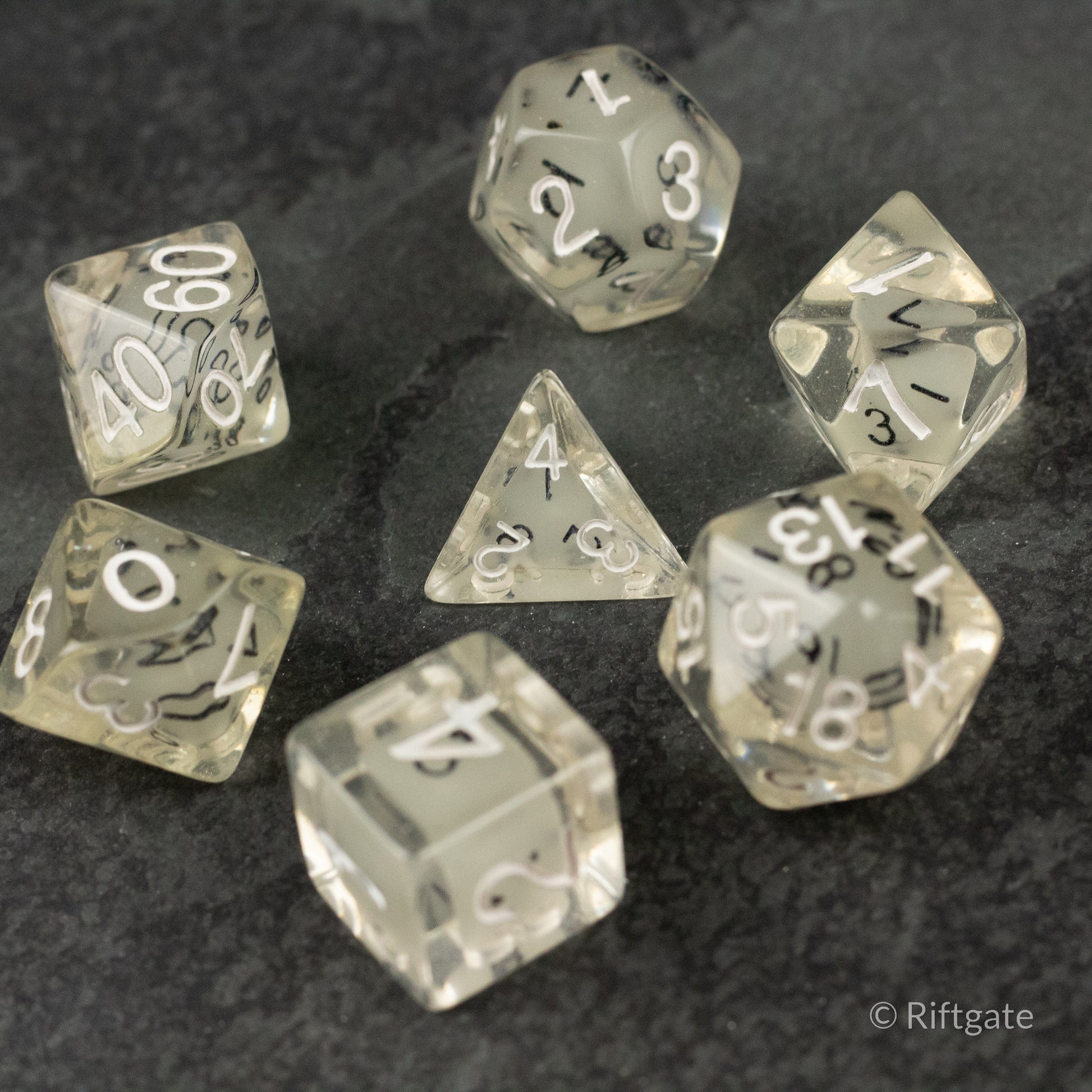 Dice in Dice Dice Set - Transparent dice set with smaller black-numbered dice inside larger clear polyhedral dice.