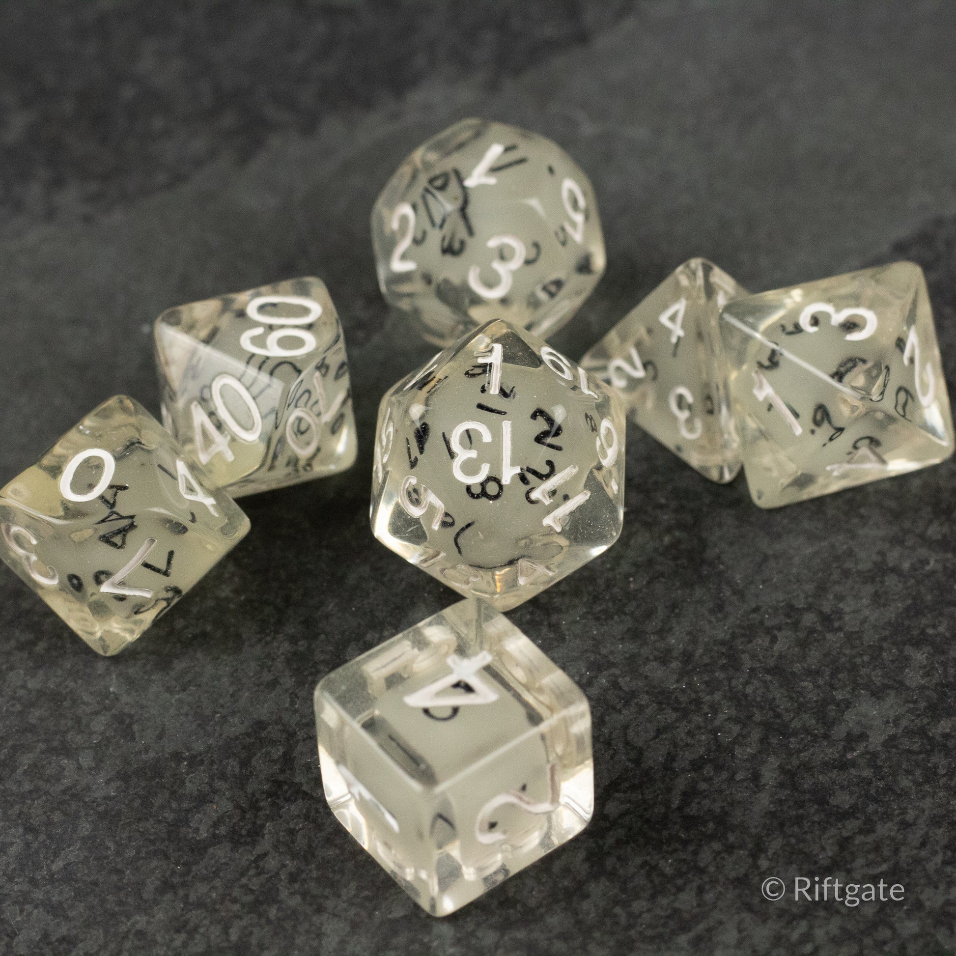Dice in Dice Dice Set - Clear acrylic polyhedral dice set with white numbers, including d4, d6, d8, d10, d12, and d20 shapes.