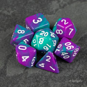 Purple and Turquoise Marbled Dice Set - Set of seven marbled polyhedral dice in purple and turquoise with white numbering on a dark textured surface.