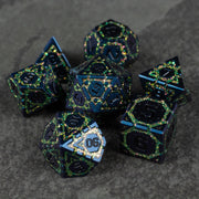 Green Superior Ward Metal Dice Set - Metallic green polyhedral dice set with sharp edges and intricate black and blue detailing.