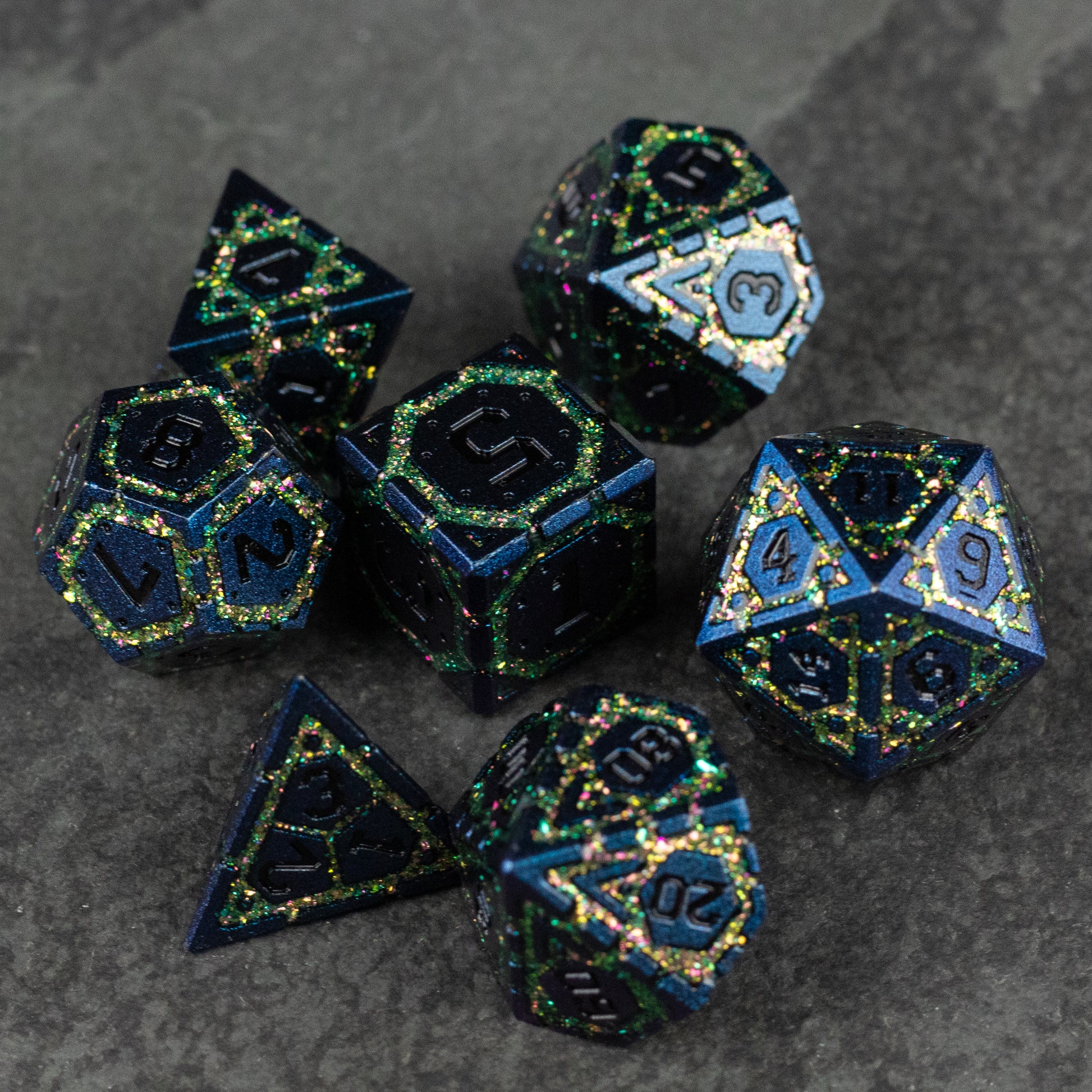 Green Superior Ward Metal Dice Set - Green metal RPG dice set with gold numbering, sparkly finish, includes d20, d12, d10, d8, d6, and d4 on a dark surface.