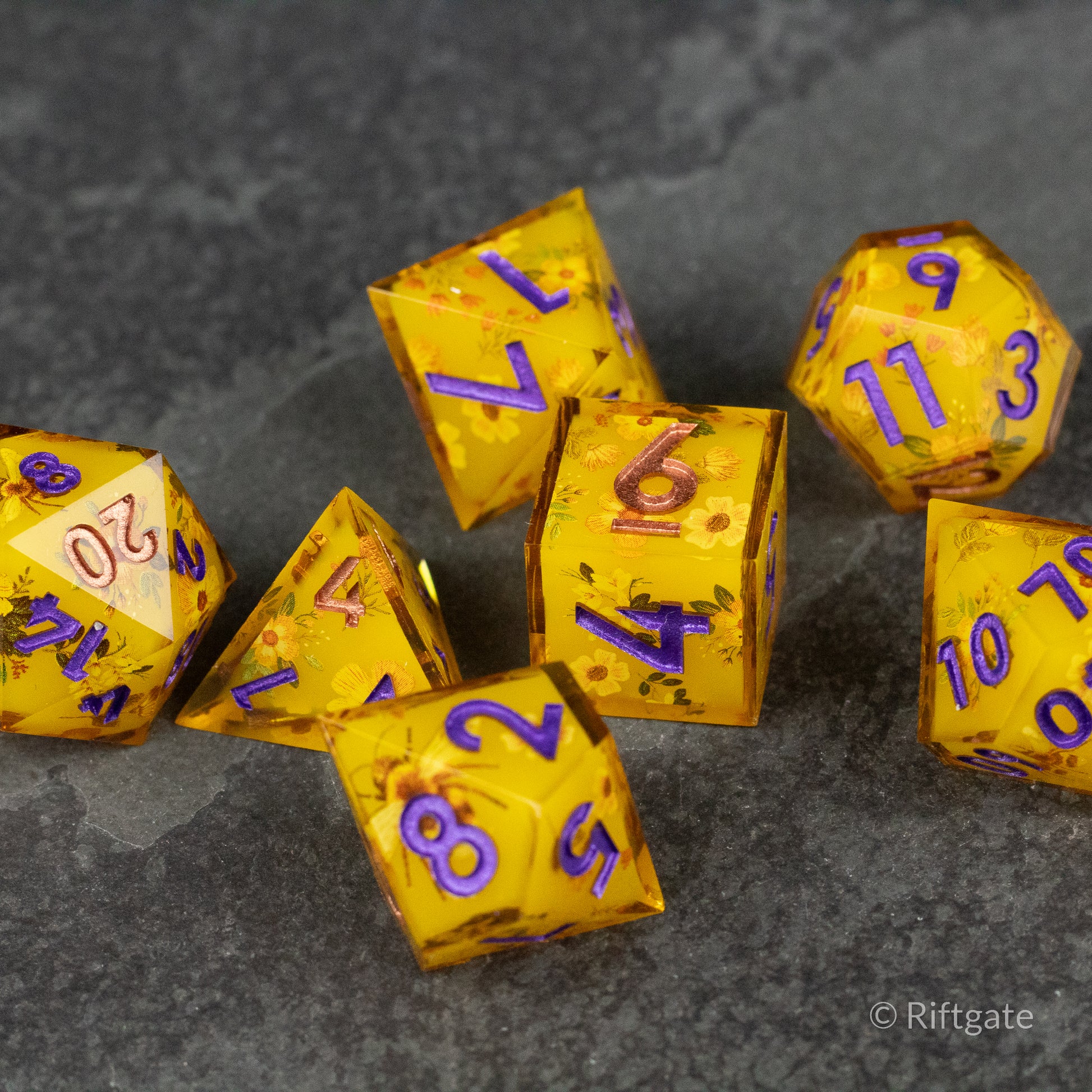 Honey Bees and Flowers Sharp Edge Dice - Set of six sharp-edged polyhedral dice in translucent golden yellow with embedded honey bee and flower motifs, featuring.