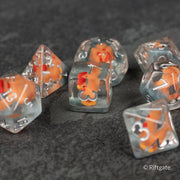 Chicken Dice Set - Clear polyhedral dice set with orange chicken illustrations inside each die, featuring numbers in white.