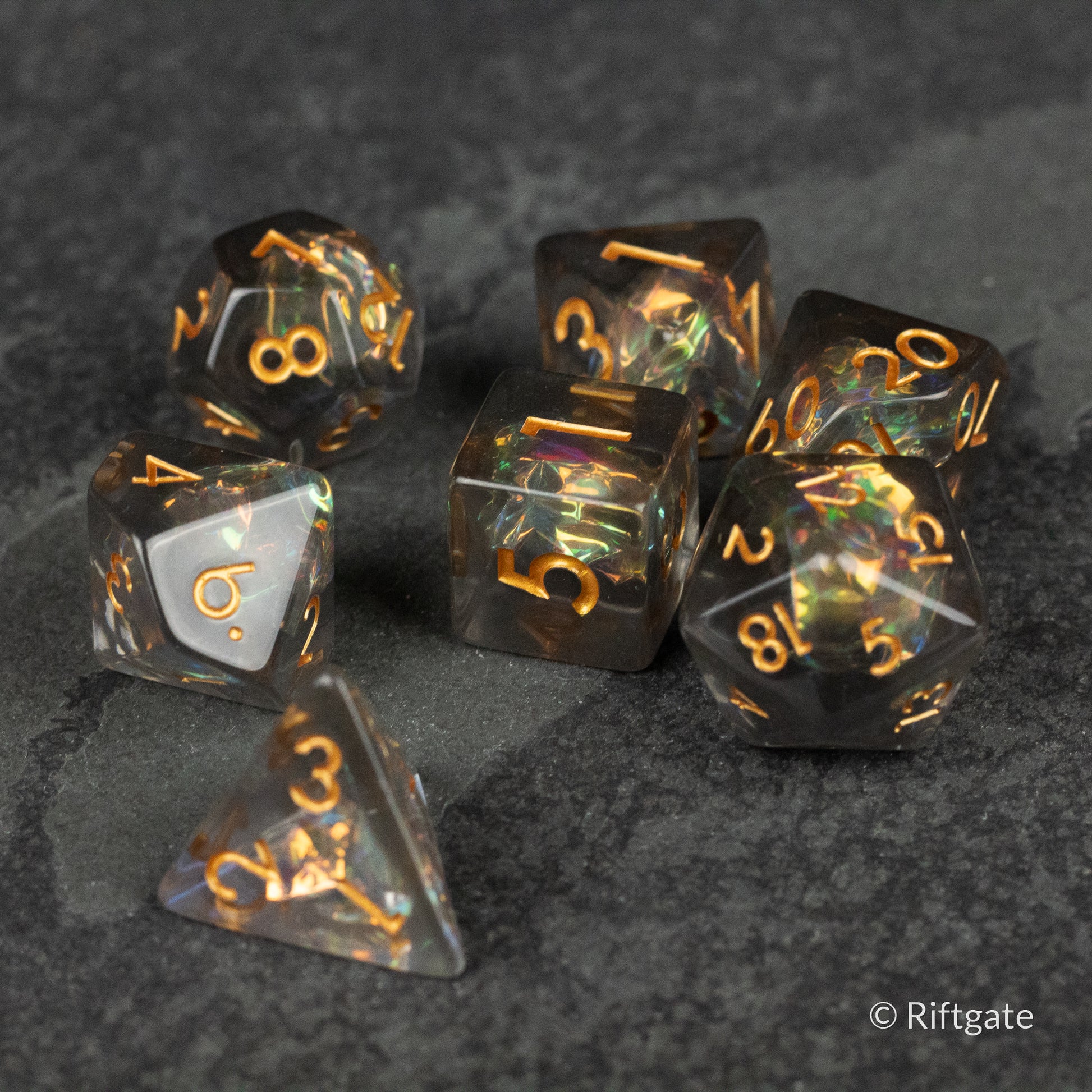 Dark Star Dice Set - Translucent black polyhedral dice set with gold numbers, including d4, d6, d8, d10, d12, and d20 shapes.