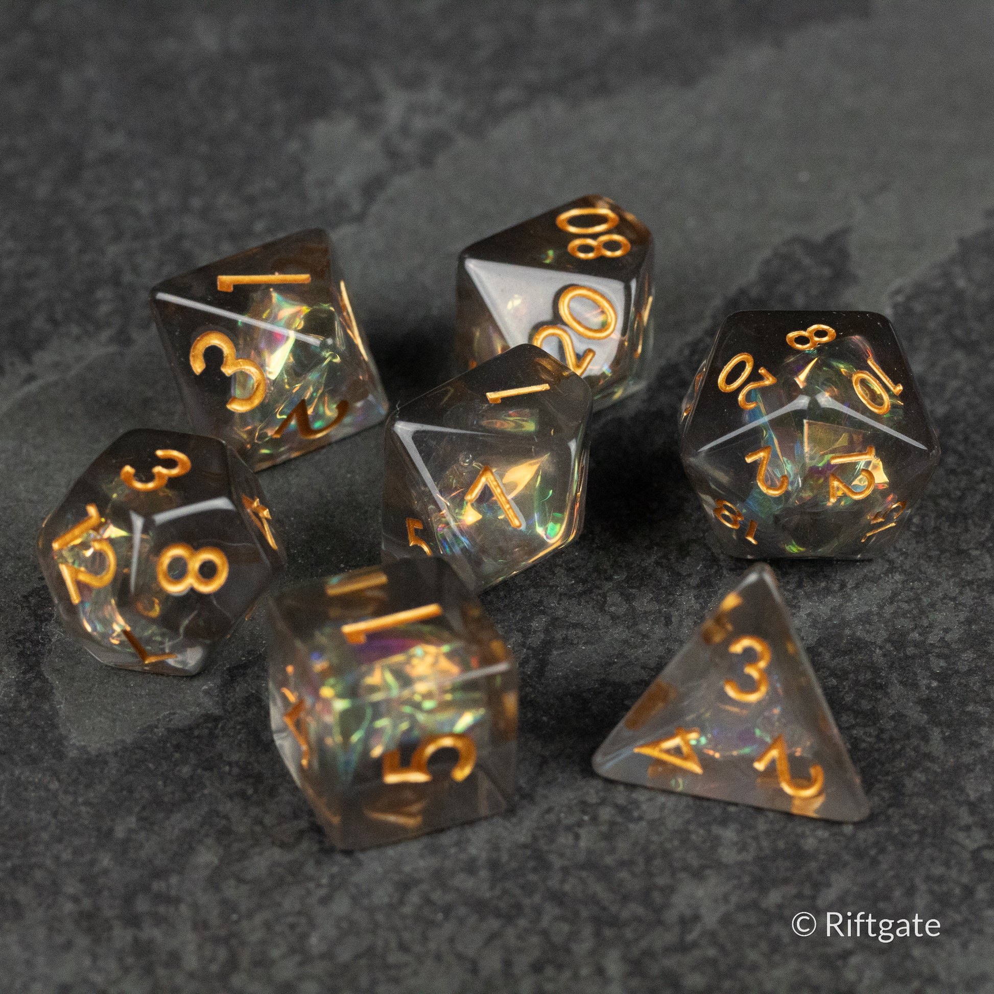 Dark Star Dice Set - Black and iridescent gaming dice set with gold numbering, featuring d4, d6, d8, d10, d12, and d20 shapes.