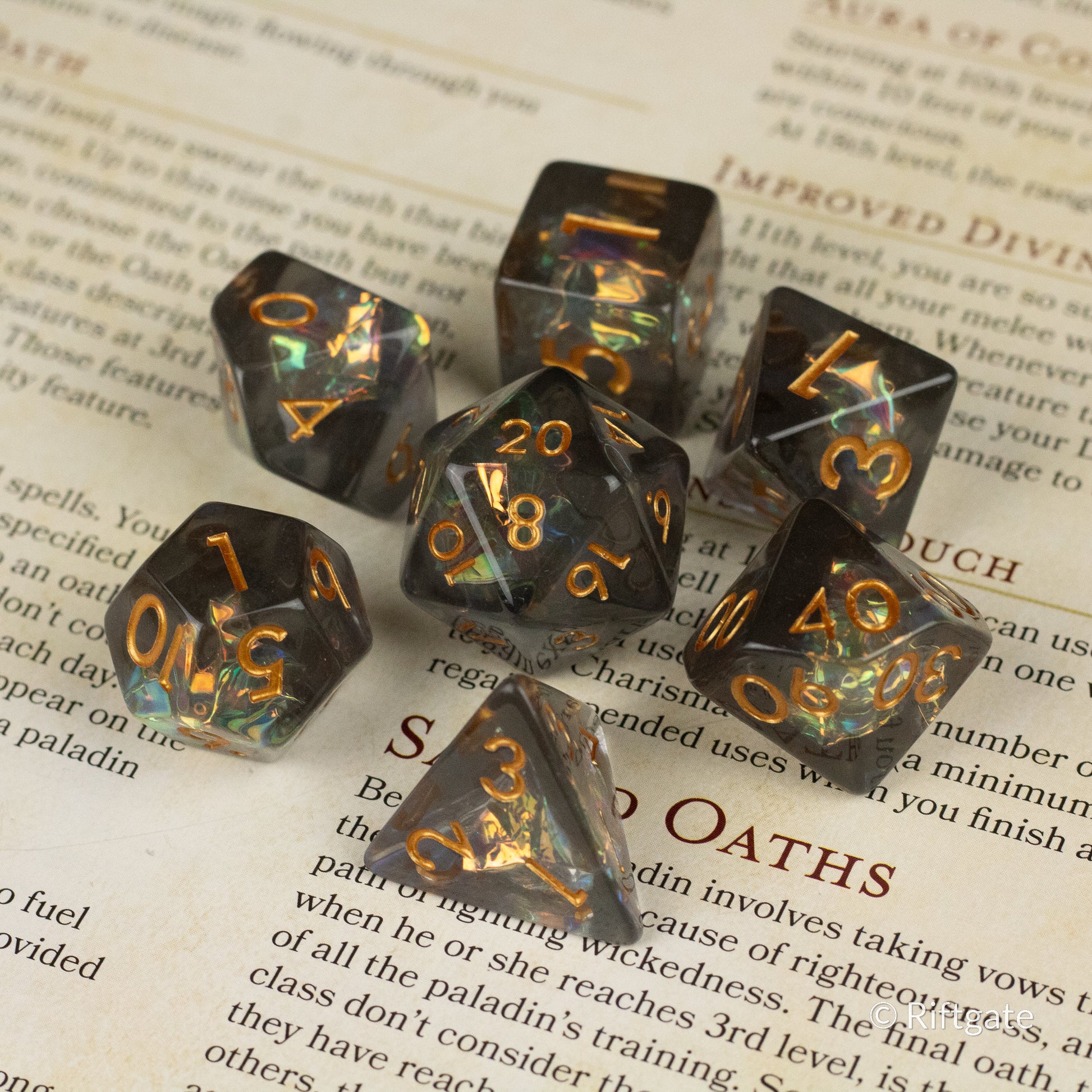 Dark Star Dice Set - Glossy black polyhedral dice set with shimmering gold numbers, including d20, d12, d10, d8, d6, and d4 designs.