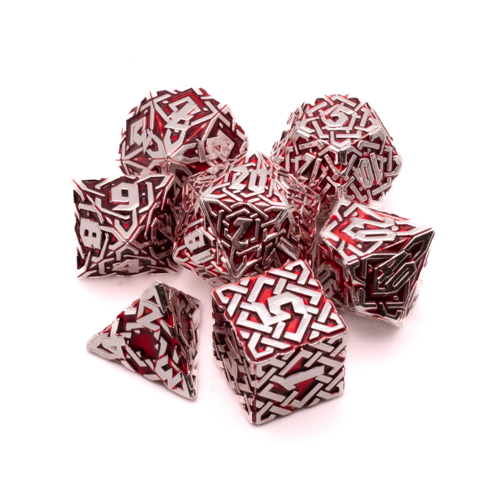 Crimson Knot Metal Dice Set - Seven metal polyhedral dice with intricate crimson knot patterns on a silver base, including d4, d6, d8, d10, d12, and d20.