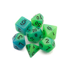 Aurora Glow in the Dark Dice Set: A round edge dice set that is colored blue with neon green gently mixed in.