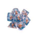 Brown Cat Inclusion Dice: Round edge dice with a brown cat set inside standing on blue sand. The numbers are white. Angle is from above