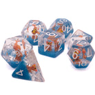 Brown Cat Inclusion Dice: Round edge dice with a brown cat set inside standing on blue sand. The numbers are white