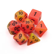 Emberlight Ignis Glow-in-the-Dark Dice Set - Seven polyhedral dice in bright orange and yellow gradient with black numbering, designed for tabletop games.