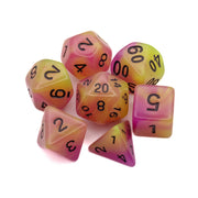 Emberlight Synth Glow-in-the-Dark Dice Set - Set of seven glow-in-the-dark polyhedral dice in yellow, pink, and orange gradient with black numbers.
