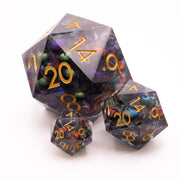 Giant Thousand Eyes D20 - Three translucent d20 dice with a purple and green marbled core and orange numbers, varying sizes shown.