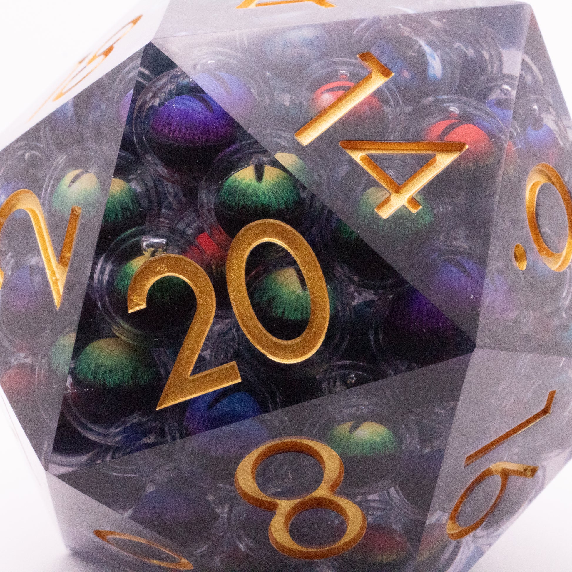 Giant Thousand Eyes D20 - Transparent purple d20 dice with multiple colorful eye patterns inside and gold numbers.