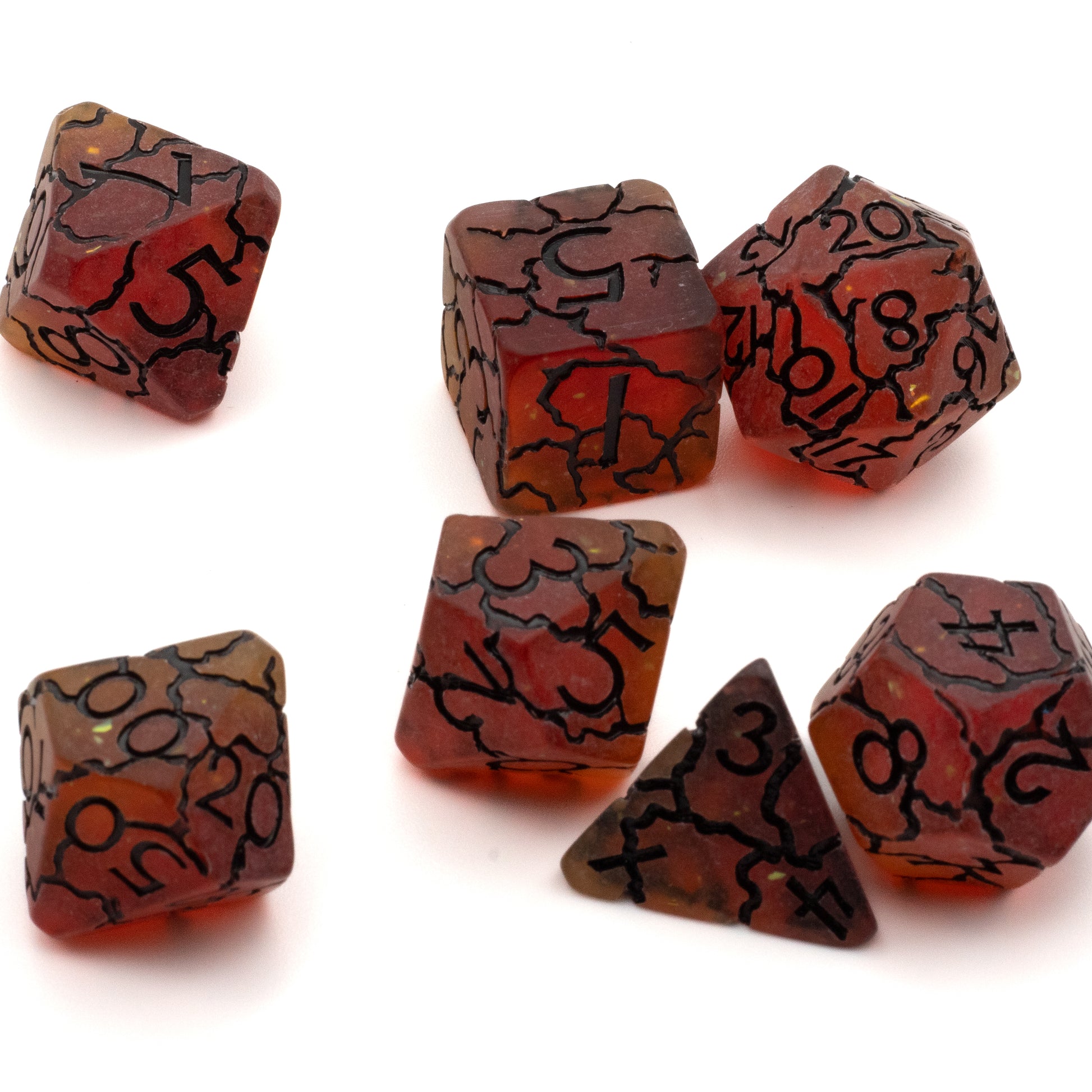 Molten Cracked Slag Dice Set - Set of seven molten red and black marbled polyhedral dice with cracked slag texture and black engraved numbers.