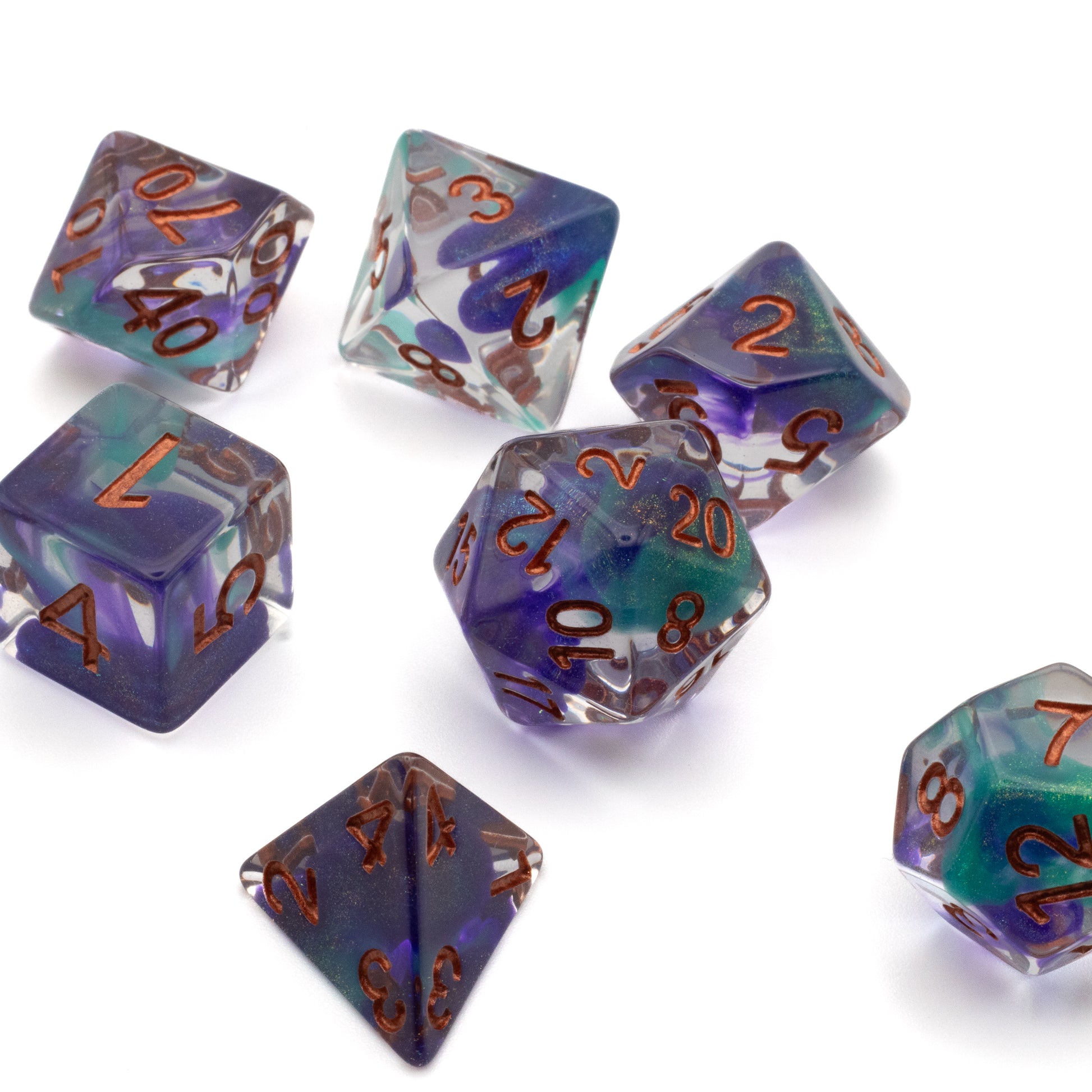 Green & Blue Arcane Ooze Dice Set - Set of translucent green and blue polyhedral dice with copper-colored numbers, featuring a swirl pattern and various shapes.