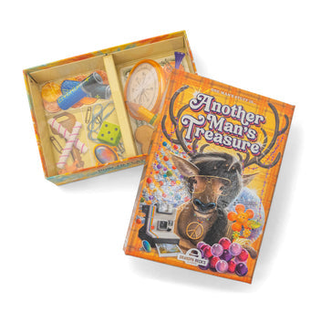 Another Man's Treasure - Orange-themed card game box labeled Another Man's Treasure with illustrations of a stag, grapes, clock, and various objects.