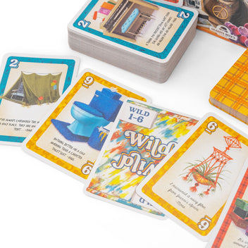 Another Man's Treasure - Card game "Another Man's Treasure" with colorful illustrated cards featuring tents, ships, and windmills, plus a wild card.