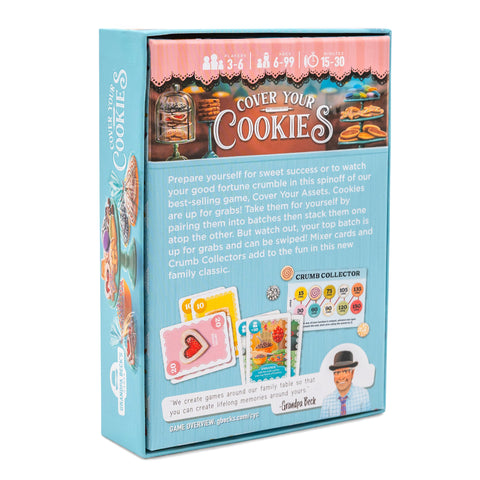 Cover Your Cookies - Light blue rectangular box with colorful cookie and card game illustrations and playful text on the back panel.