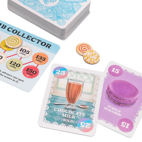 Cover Your Cookies - Colorful card game pieces including a chocolate milk card, purple macaron card, round cookie tokens, and a card collector.