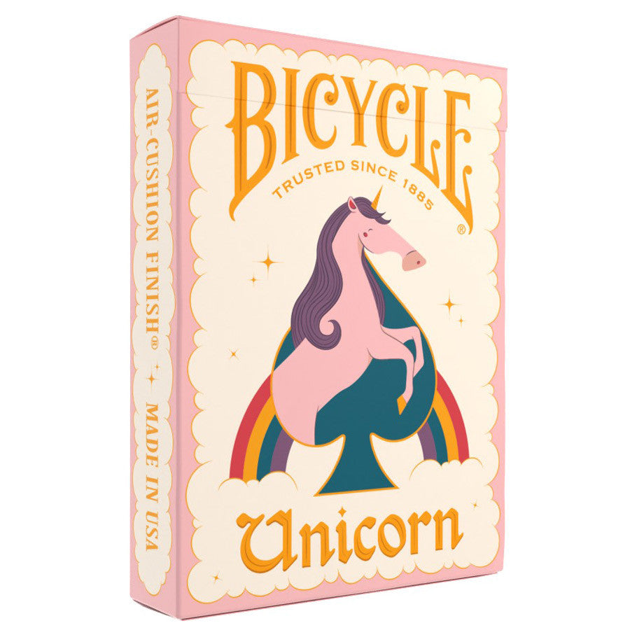 Bicycle Playing Cards: Unicorn Pink - Pink Bicycle playing cards box featuring a stylized purple and pink unicorn above a rainbow on cream background.