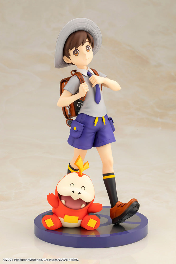 Pokemon Florian with Fuecoco ARTFX J STATUE - Pokemon Florian figure with tan hat, white shirt, purple shorts, black shoes, and red Fuecoco sitting on a blue base.