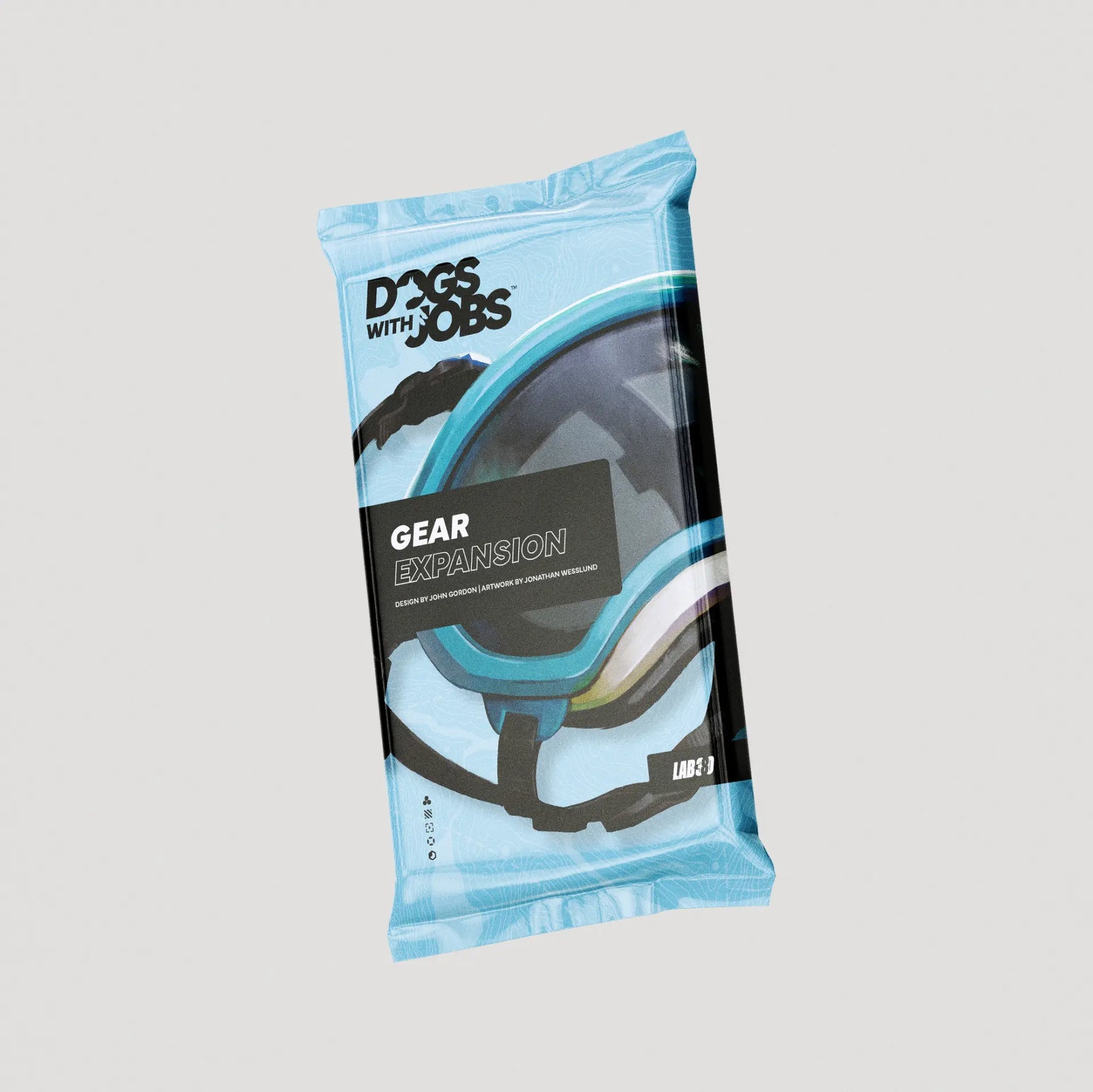 Dogs With Jobs: Gear Expansion - Light blue rectangular pack with black and gray text and dog harness graphic labeled Dogs With Jobs Gear Expansion.