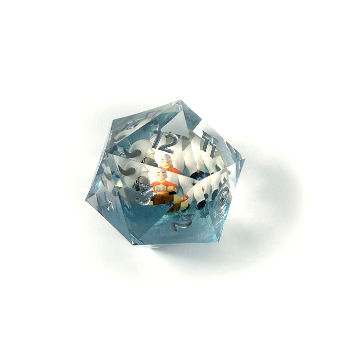 Sirius Dice 55mm Spindown d20: Magic the Gathering: Avatar The Last Airbender - Transparent 55mm d20 spindown dice with black numbers and an inner colorful Avatar The Last Airbender design.