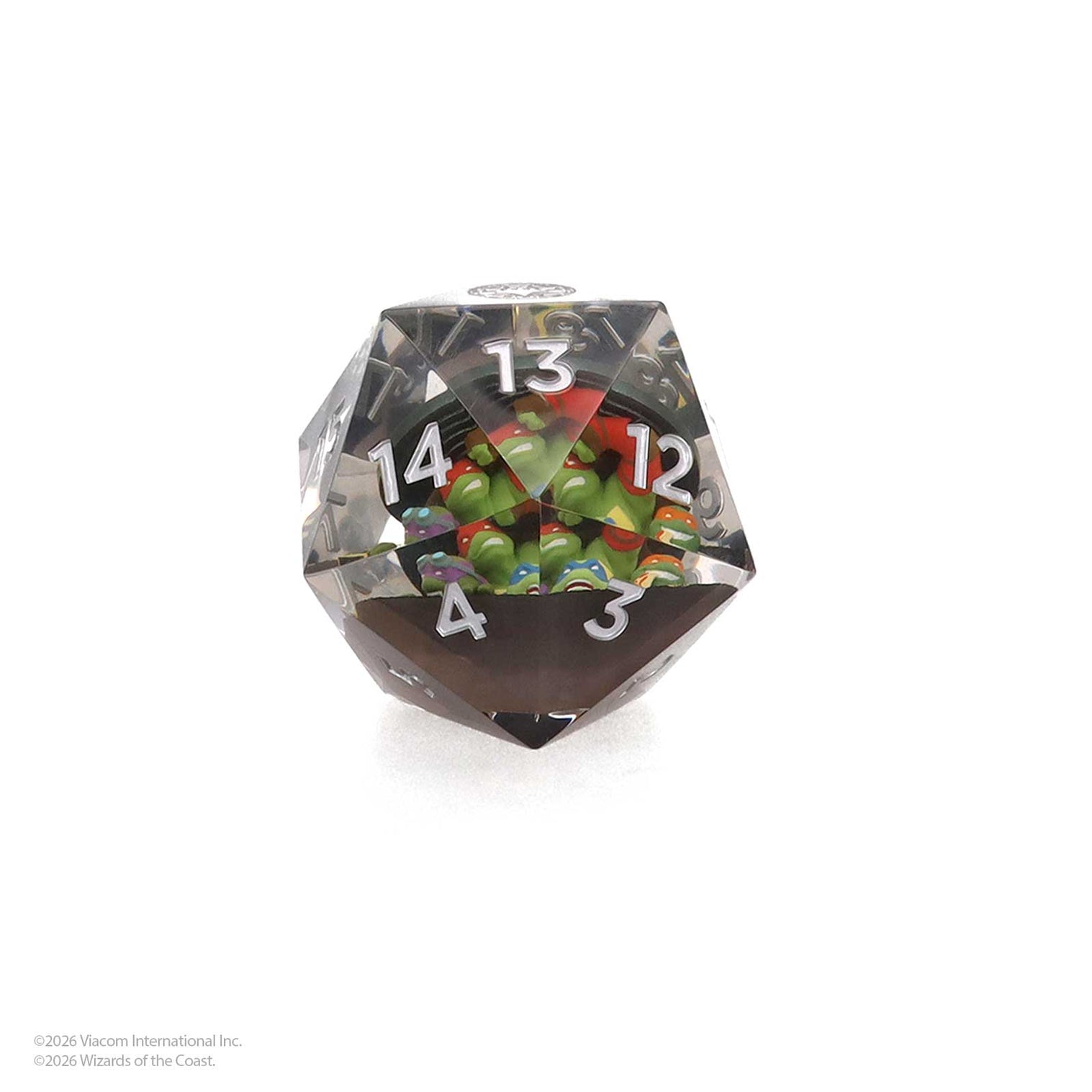 Sirius Dice 55mm Spindown d20: Magic the Gathering: Teenage Mutant Ninja Turtles - Transparent 55mm 20-sided spindown die with white numbers and Teenage Mutant Ninja Turtles graphic inside.